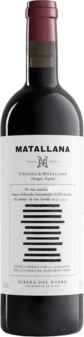 Het label is minimalistisch met de naam 'Matallana' prominent bovenaan. Er is een centraal embleem met de letter 'M'. Onder de naam staat 'Viñedos de Matallana' vermeld met een locatieaanduiding. Er zijn ook horizontale zwarte strepen die wellicht een artistiek element vormen.