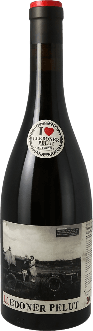 VdF Le Temps des Vendanges 2022 Het label toont een zwart-wit foto van mensen op een kar in een landelijke omgeving. De tekst 'Lledoner Pelut' staat prominent onderaan in grote letters, en er is ook kleinere tekst aanwezig. Bovenaan de fles is een sticker met de tekst 'I ♥ Lledoner Pelut Eco-Friendly'.